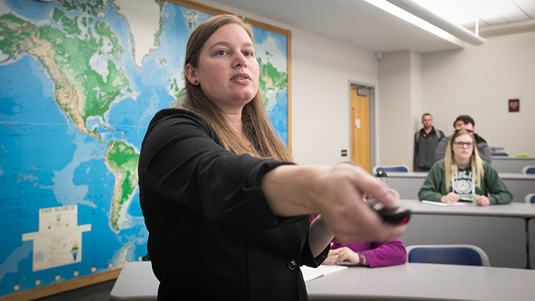 Dr. Julia Troche uses a presentation clicker to teach her Ancient Egyptian History class.