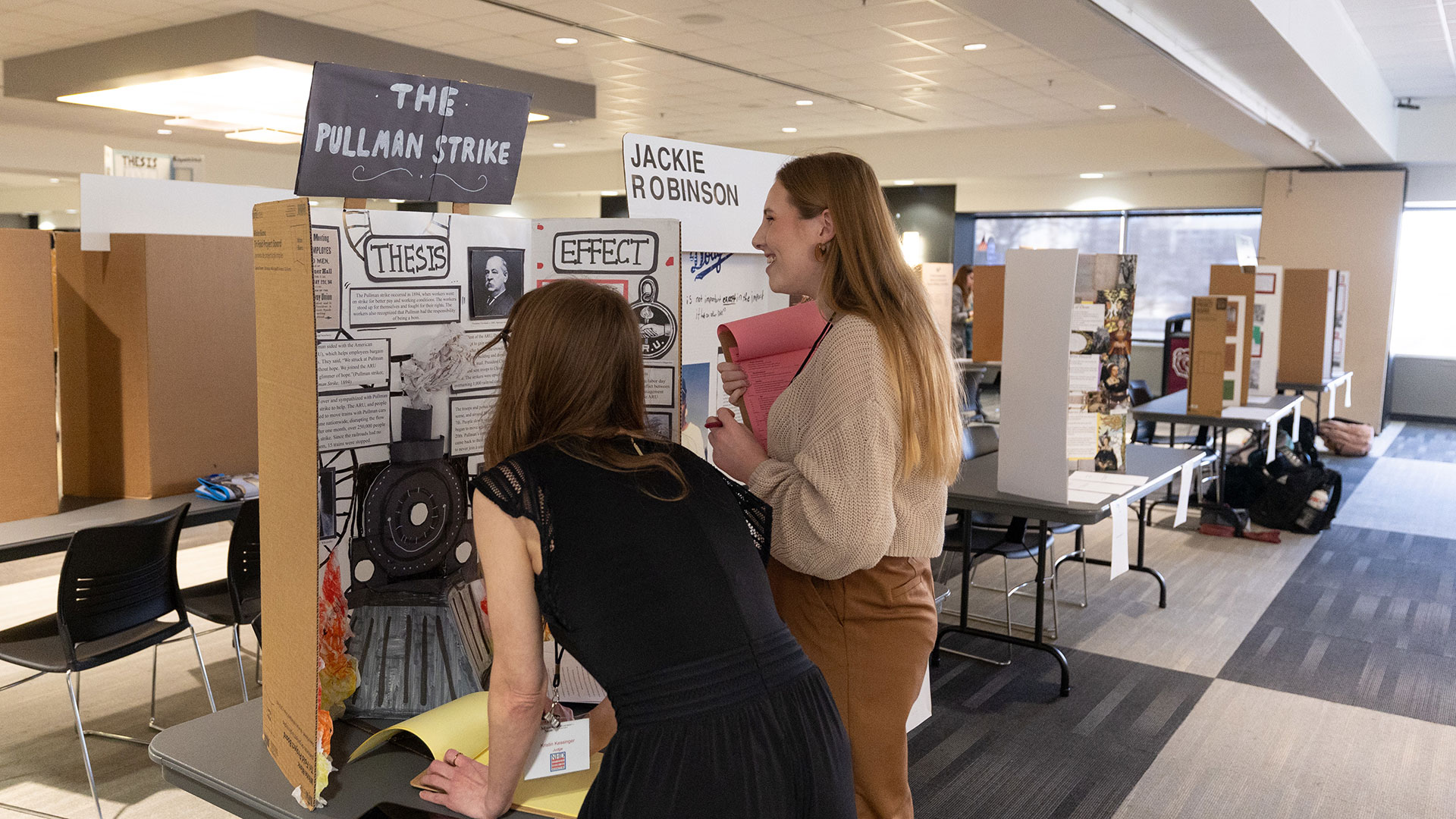 History majors and experts judge students' projects during National History Day competition.