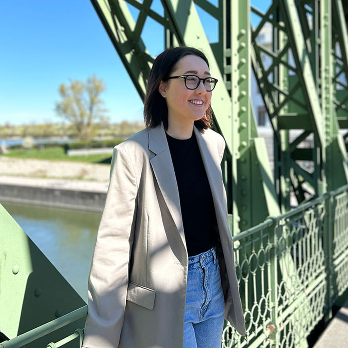 Anna Guenter poses on a green bridge